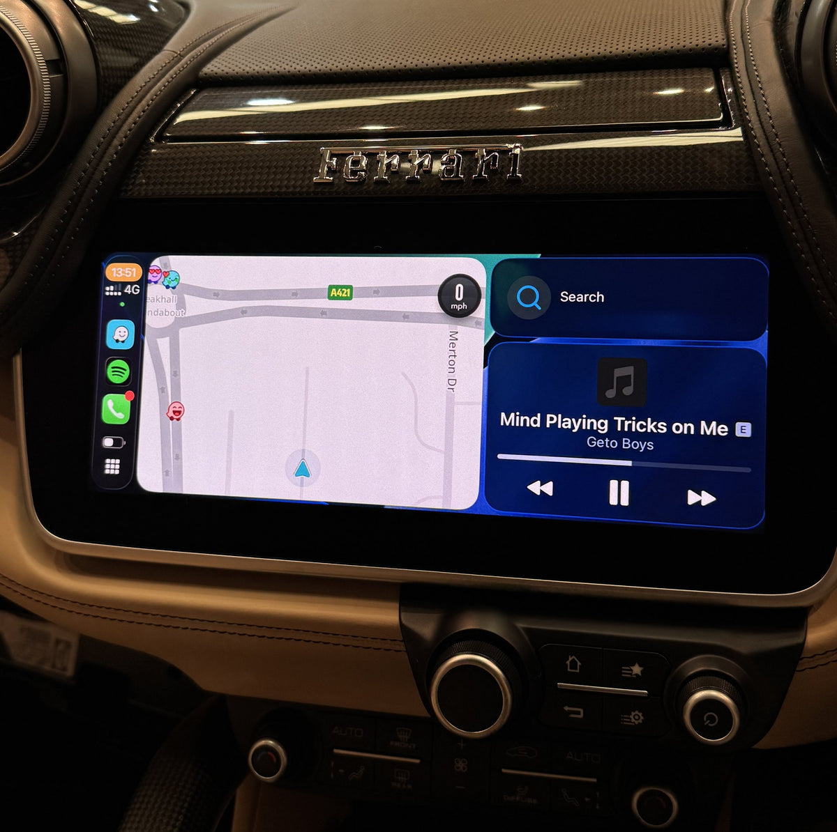 Apple Maps and music through wireless CarPlay on the factory screen of a Ferrari GTC4Lusso