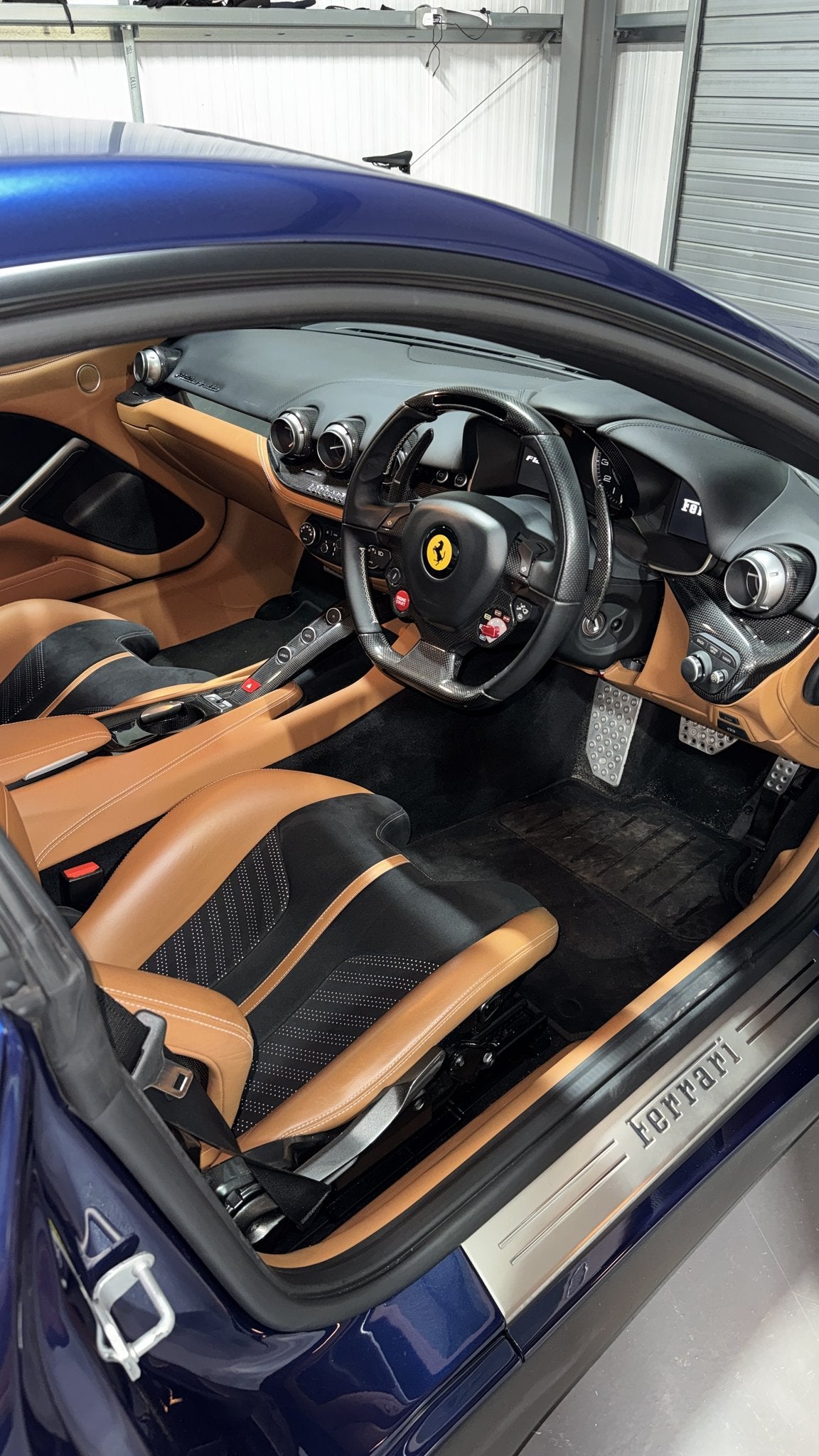 Ferrari F12berlinetta interior in for an Apple CarPlay retrofit at 12K Retrofits