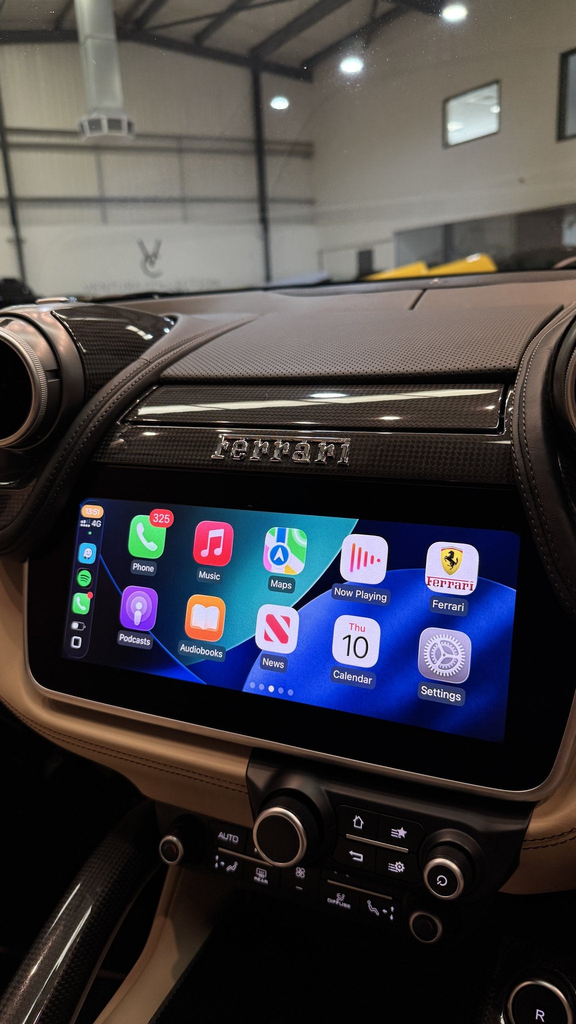 Apple CarPlay home screen on the factory display of a Ferrari GTC4Lusso