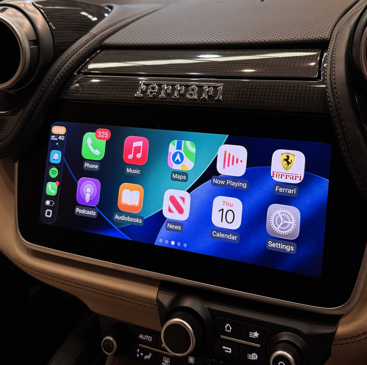 Apple CarPlay home screen on the factory display of a Ferrari GTC4Lusso