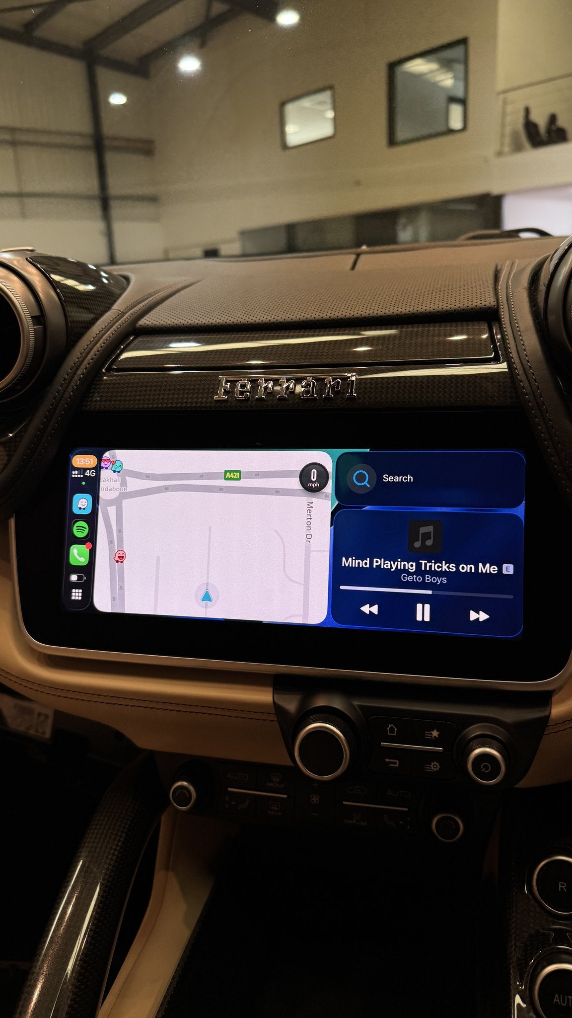 Apple Maps with music playing through CarPlay on a Ferrari GTC4Lusso screen