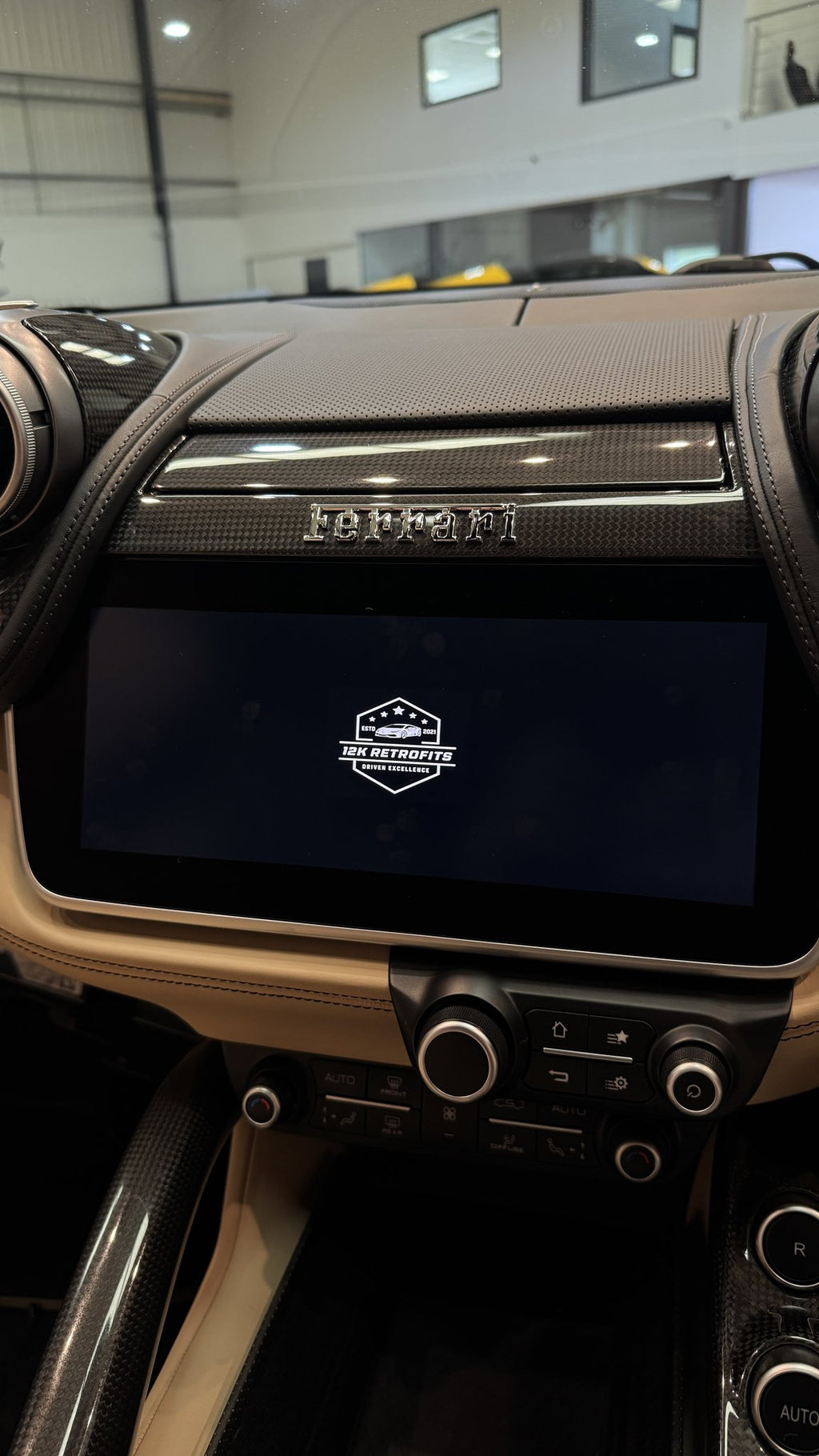 12K Retrofits start-up logo on the factory screen of a Ferrari GTC4Lusso