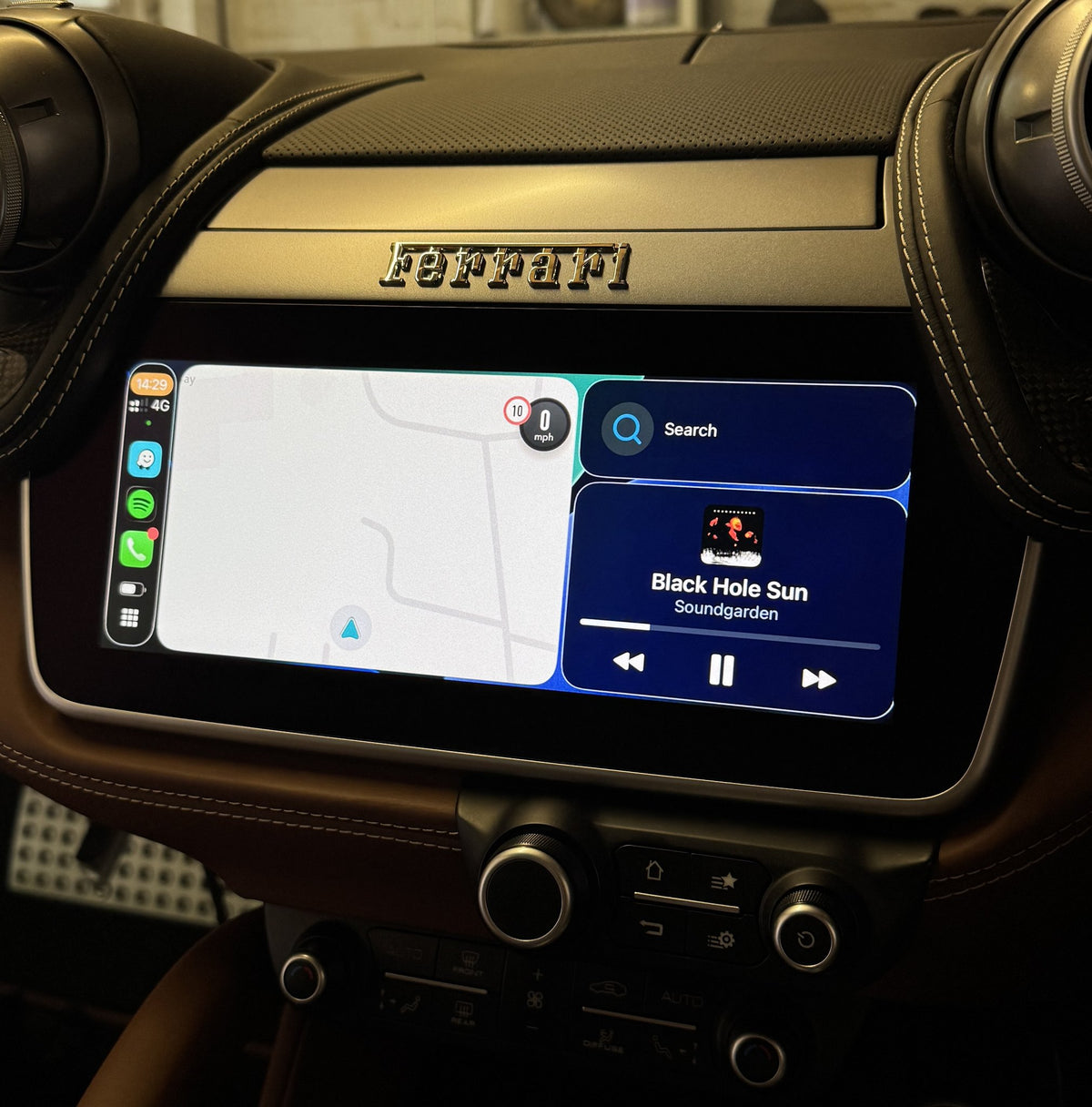 Maps and music through wireless CarPlay on a Ferrari Portofino screen