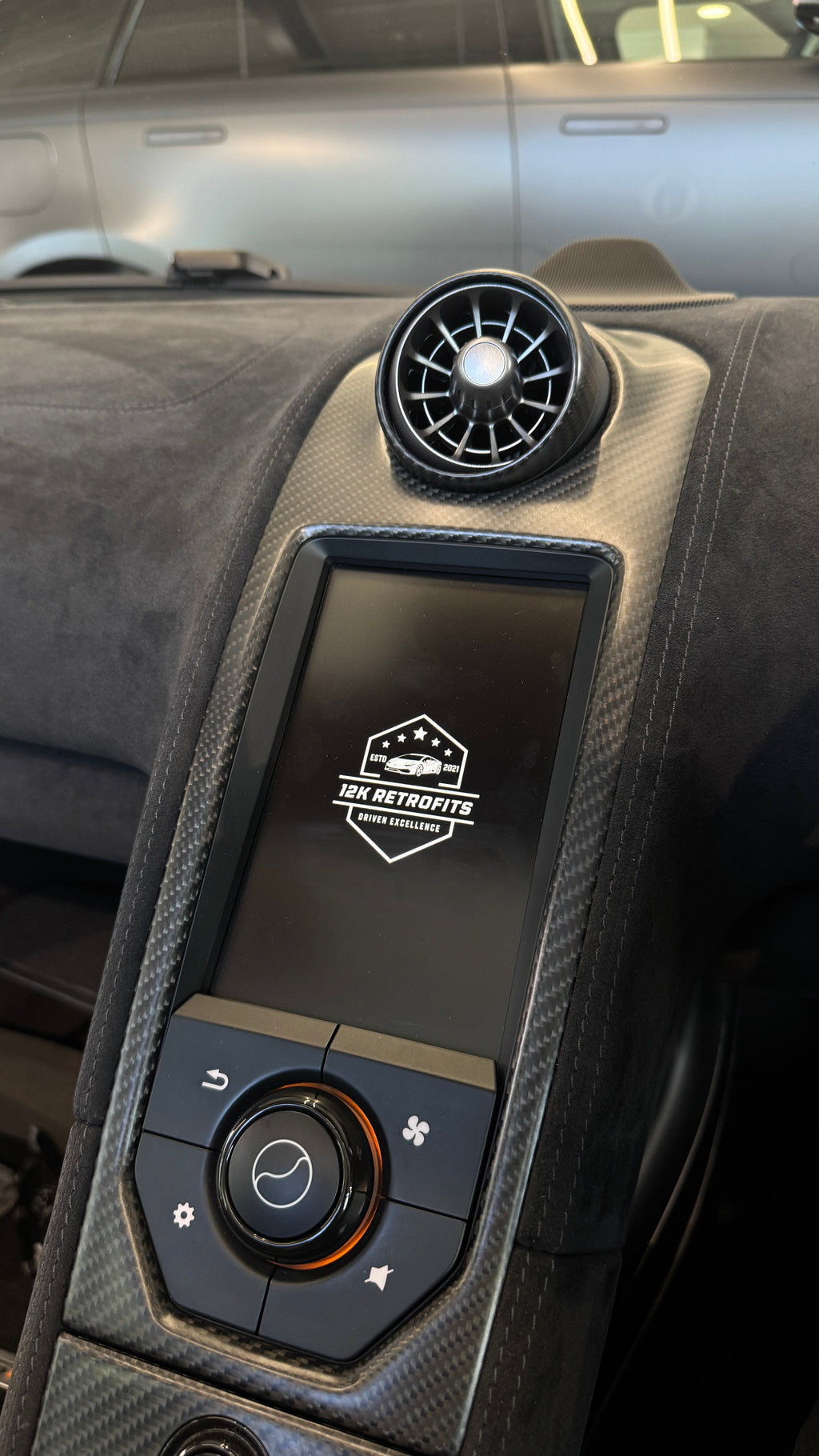 Apple CarPlay retrofit fitted to the factory IRIS screen of a McLaren 675LT