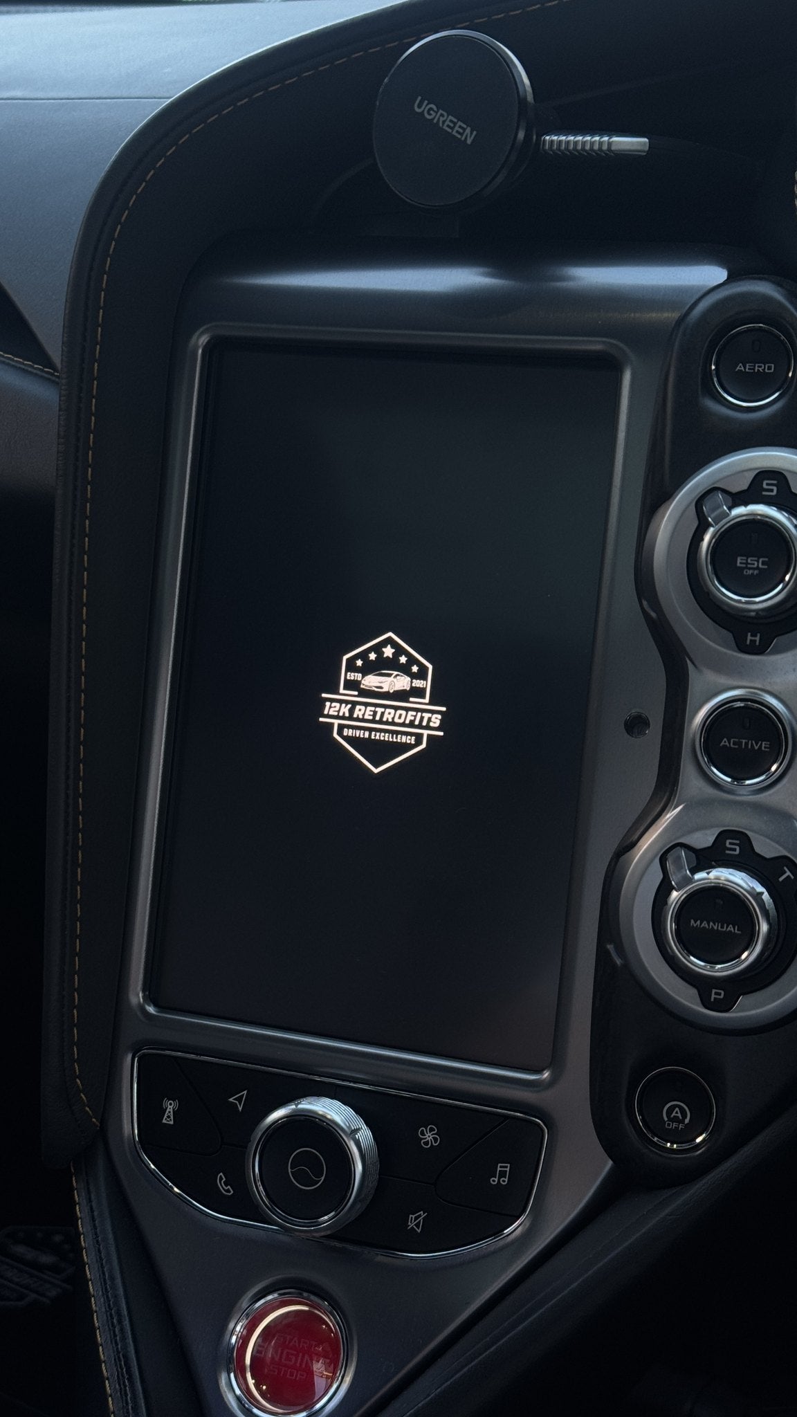 12K Retrofits start-up screen on the centre display of a McLaren 765LT